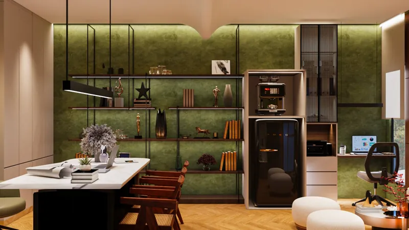 Display Wall: black metal shelves against the olive wall, with hidden profile lights and a tall pantry unit for the coffee machine and fridge. Indéva Studio Office, Narela.